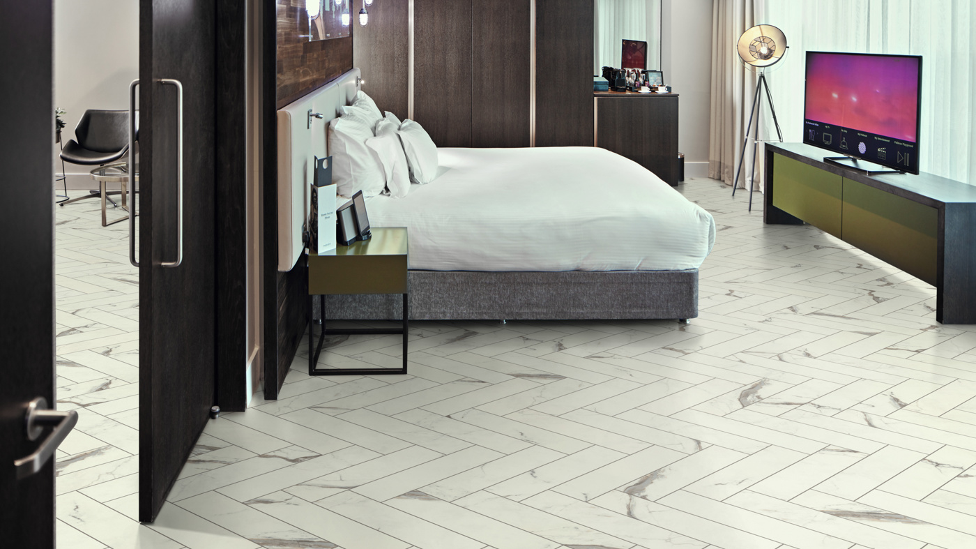 Hotel suite with Brunella Marble SM-RKT3013-G herringbone floors