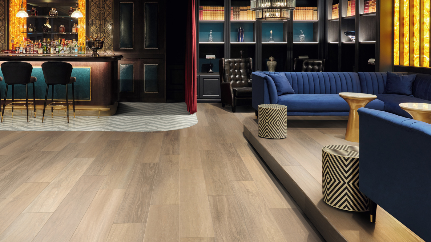 Dune Oak RL24 floors with custom cut Calacatta d'Oro LM33 and Pavimento Bianco LM42 herringbone floors to zone the bar area